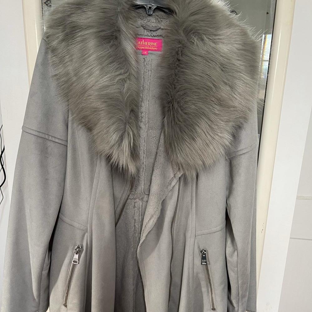 NWOT- Faux Fur Coat. NEW NEVER WORN. Very soft and warm. Beautiful condition